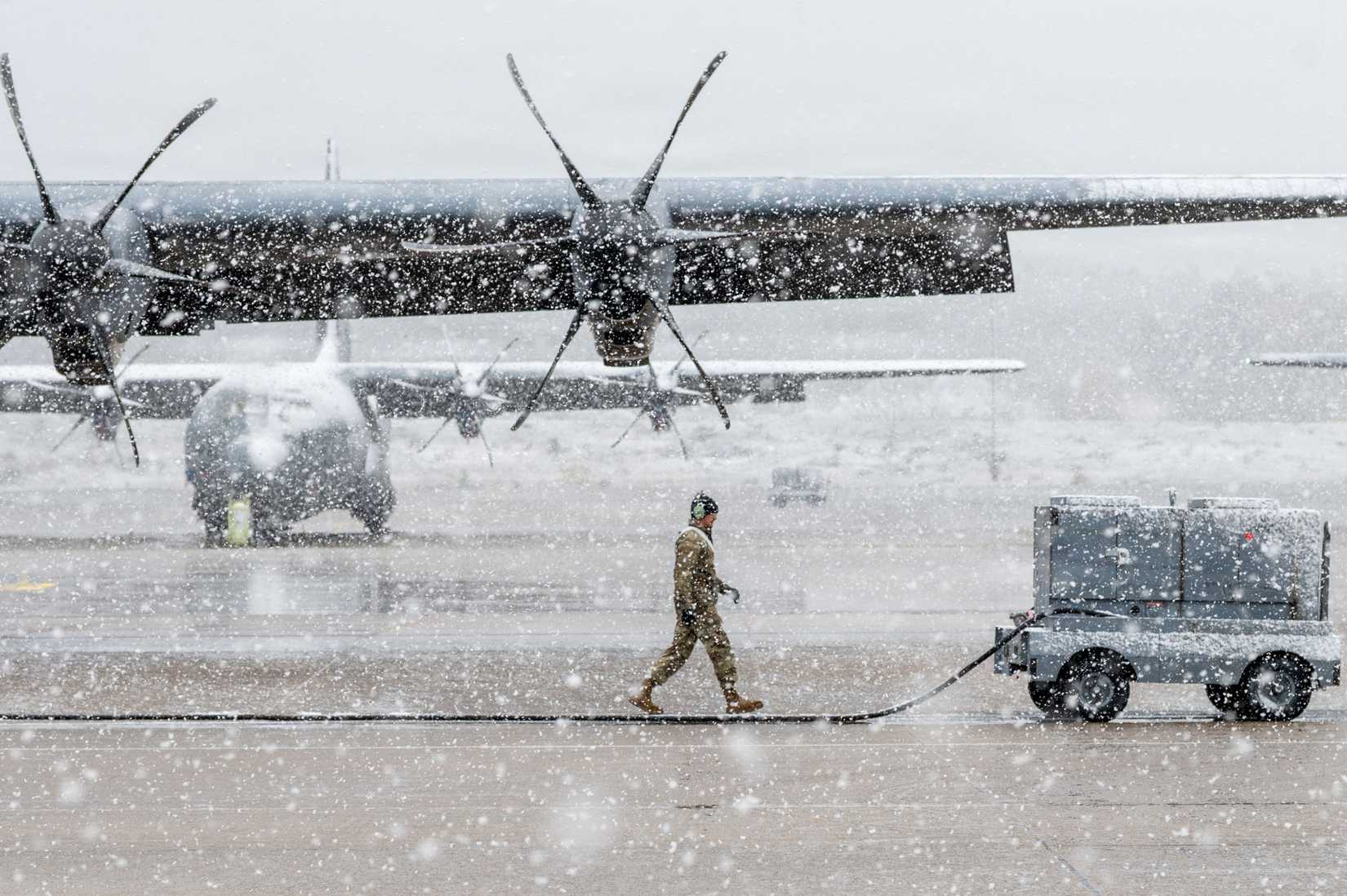 An Airman assigned to the 86th Airlift Wing moves a power cord next to a C-130J Super Hercules aircraft at Ramstein Air Base, Germany, Nov. 19, 2025.