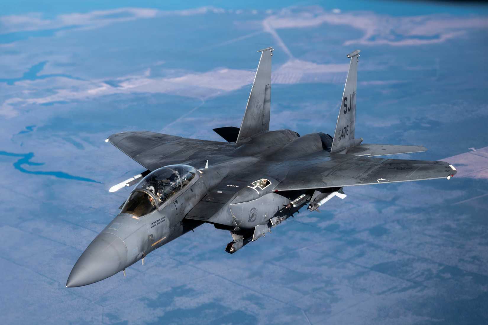 An F-15E Strike Eagle with the 4th Fighter Wing approaches a KC-135 Stratotanker from the 121st Air Refueling Wing.