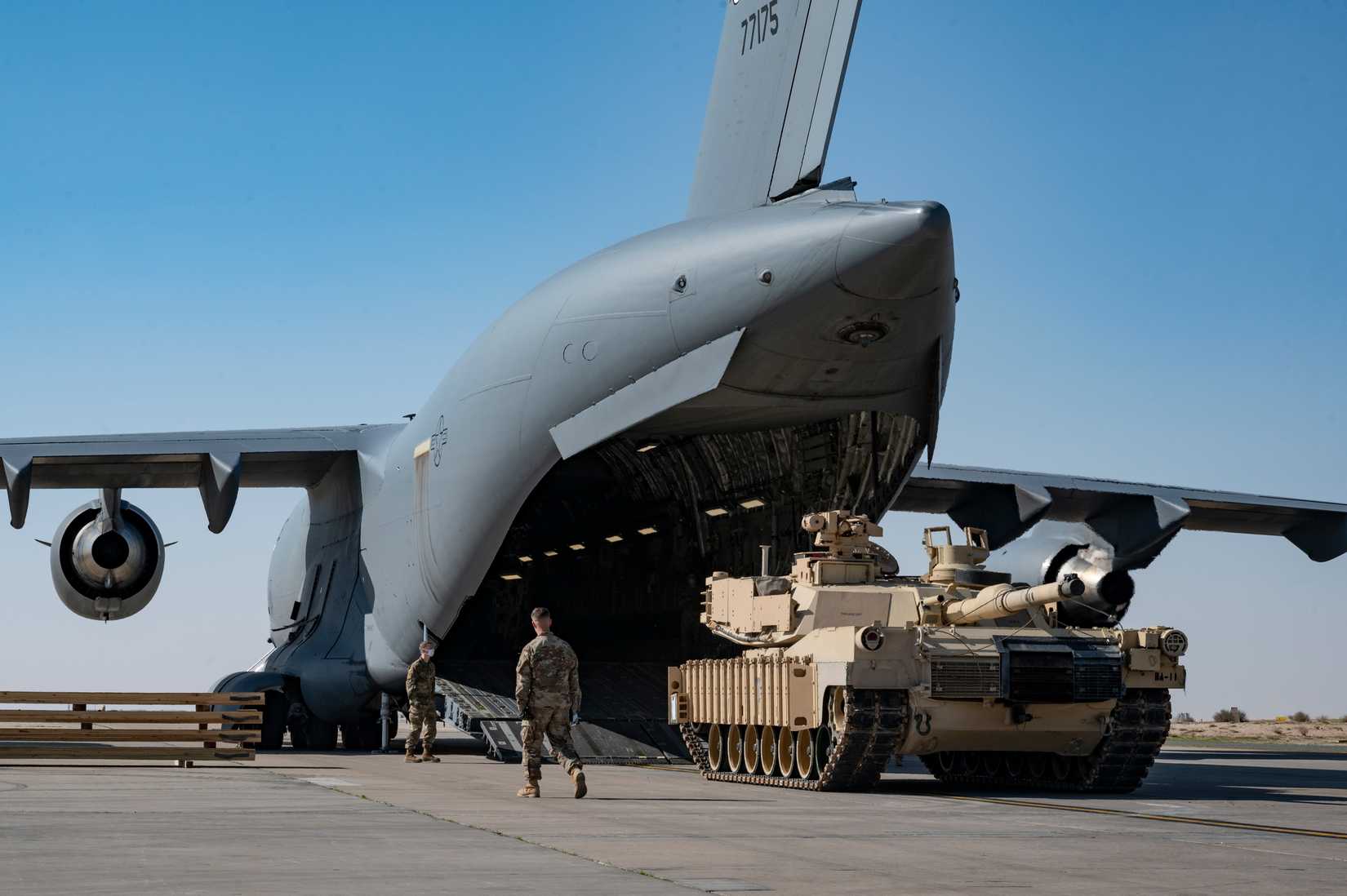 Army 1st Battalion loads an M1A2 SEPv2 Abrams Tank onto a C-17 Globemaster III at Ali Al Salem Air Base, Kuwait, 2022.