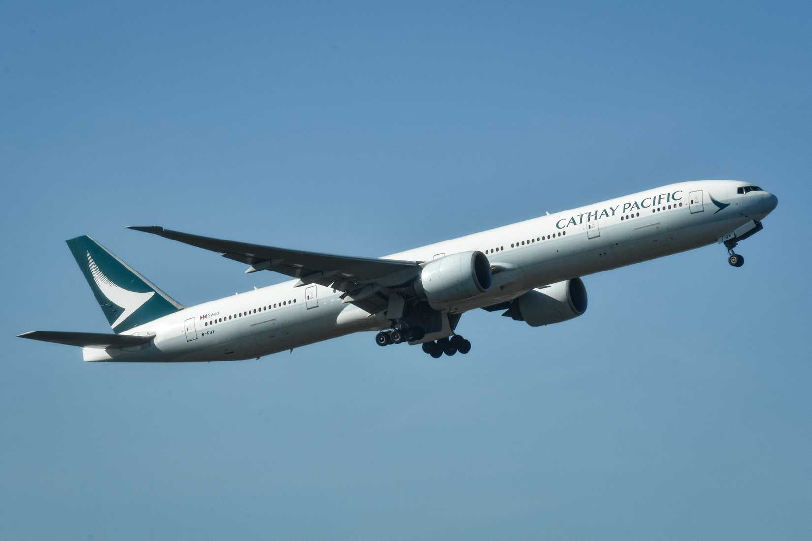 Cathay Pacific 777-300 B-KQV departing Heathrow.