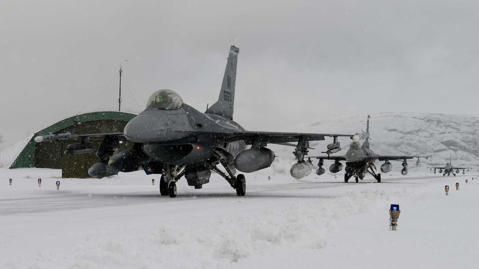 F-16 Fighting Falcons from Aviano Air Base, Italy, taxi to their hangars at Bodø Main Air Station, Norway, Feb. 27, 2016.