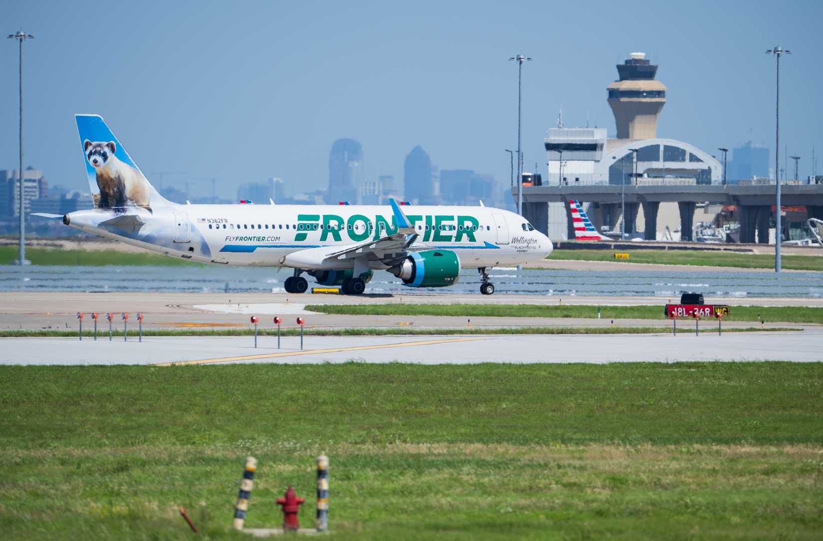 Frontier Airlines aircraft Airbus A320-251N taxiing to take off at the Dallas Fort Worth International Airport (DFW).
