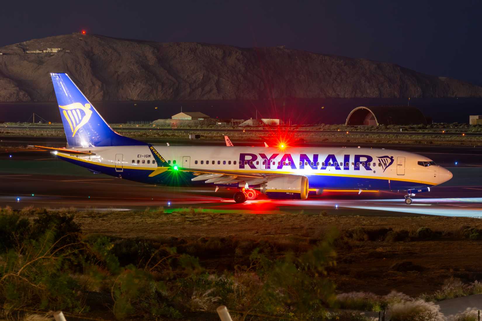 Nighttime photograph of a Ryanair Boeing 737 MAX airliner at Gran Canaria Airport.