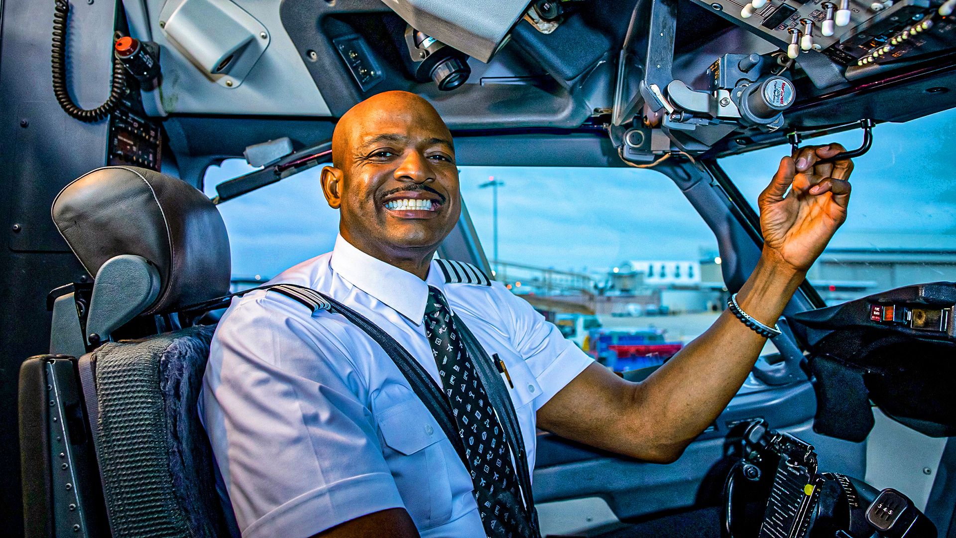 A Southwest Airlines Pilot Seated In The Cockpit
