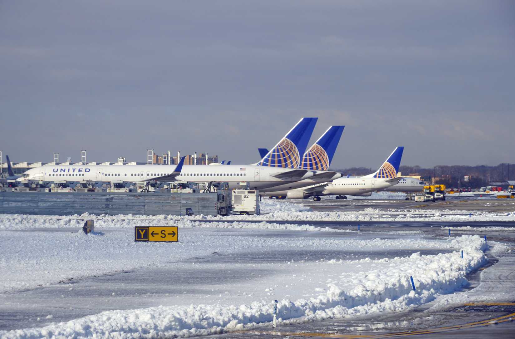 View of airplanes from United Airlines (UA) after a winter snow storm at Newark Liberty International Airport (EWR) near New York City.