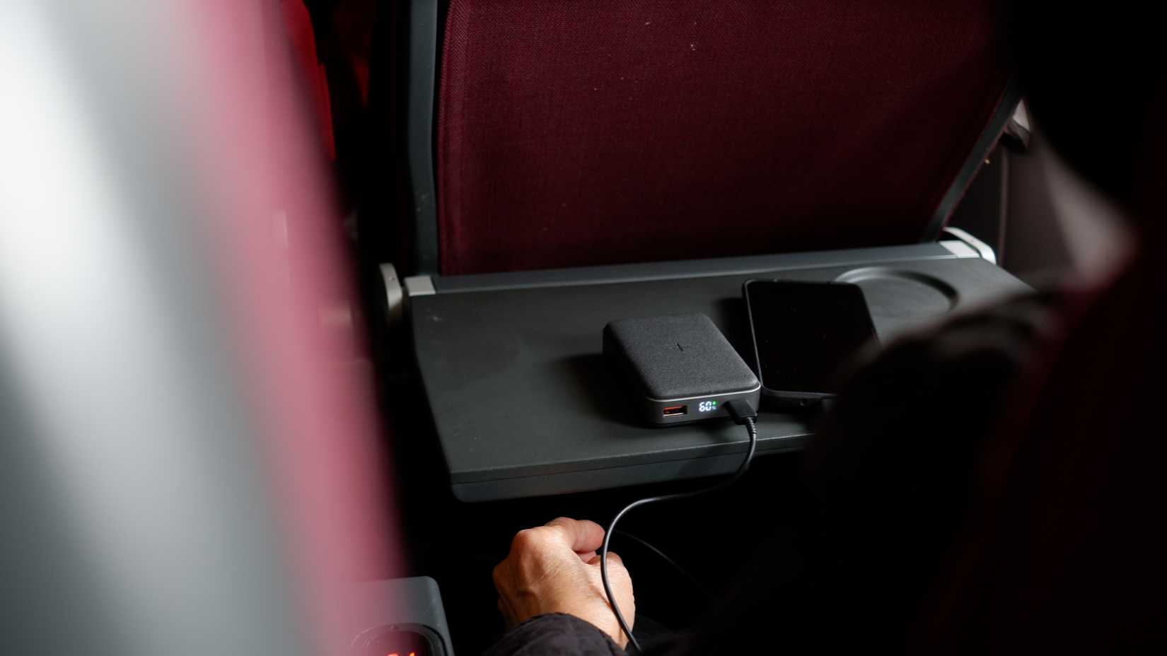 Passenger Using Power Bank On Plane