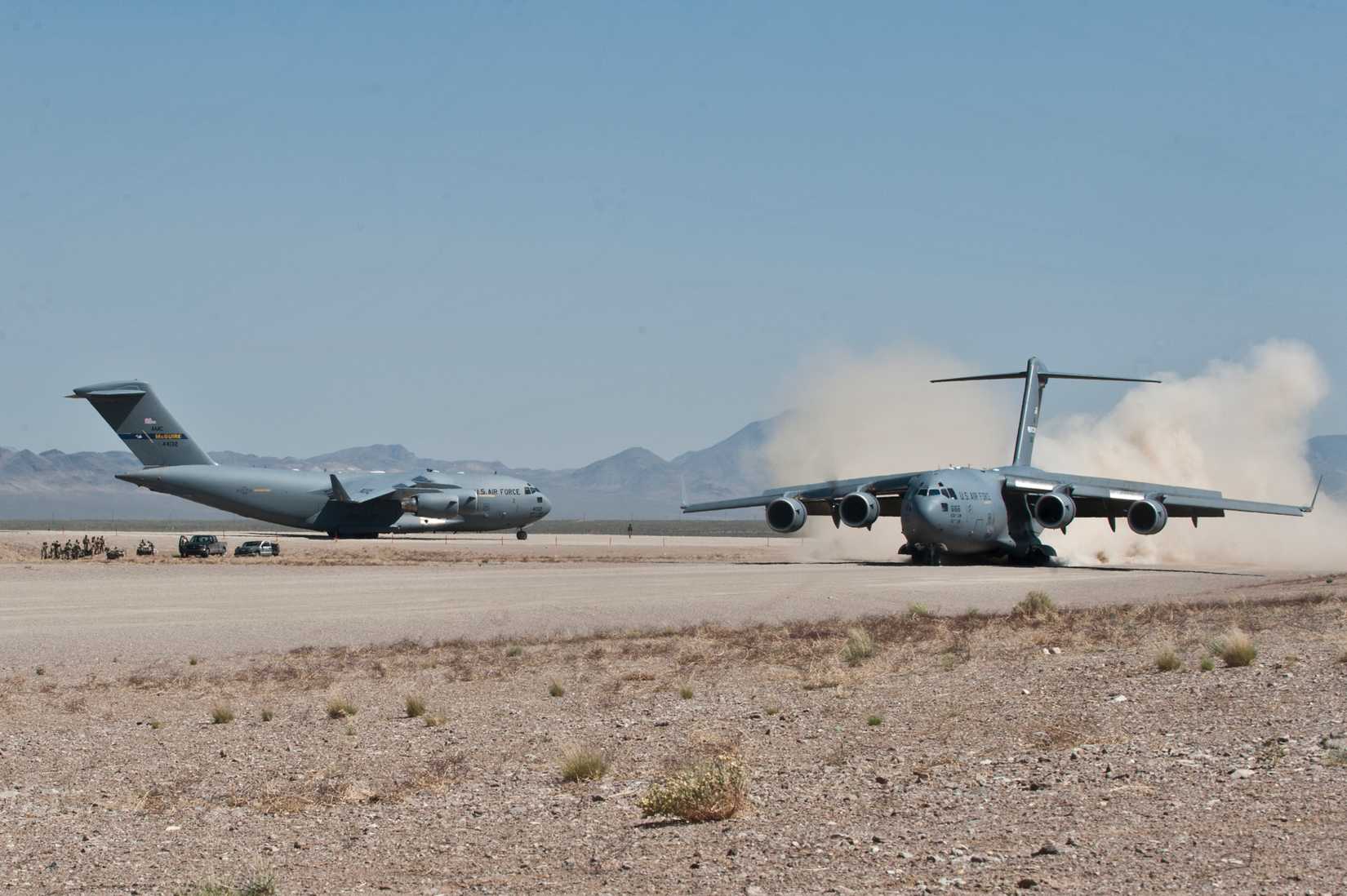 Two C-17 Globemaster III cargo aircraft prepare to take off from the Nevada Test and Training Range, Nevada, 2012.