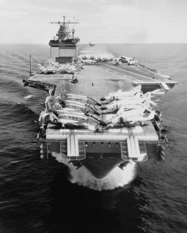 Underway at sea on 10 April 1962, with another carrier astern.  McDonnell F4H-1 Phantom II fighters on deck.