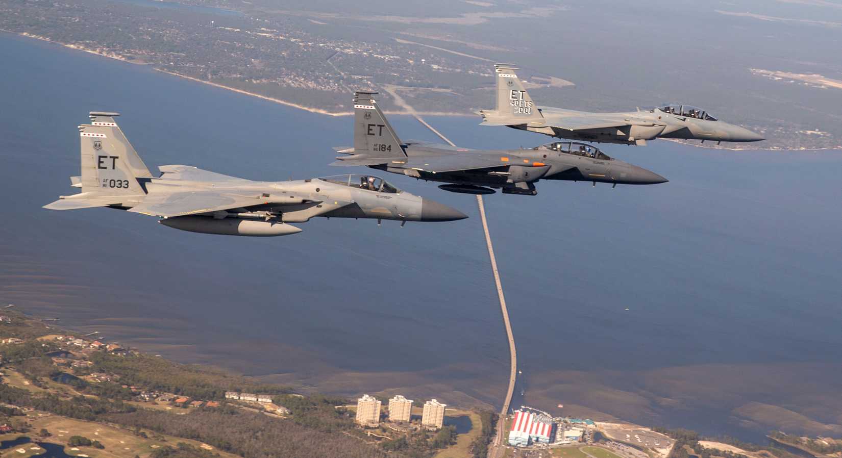 An F-15EX (upper, right) in formation with an F-15E (center) and F-15C (lower, left) while on delivery to Eglin AFB, 2021