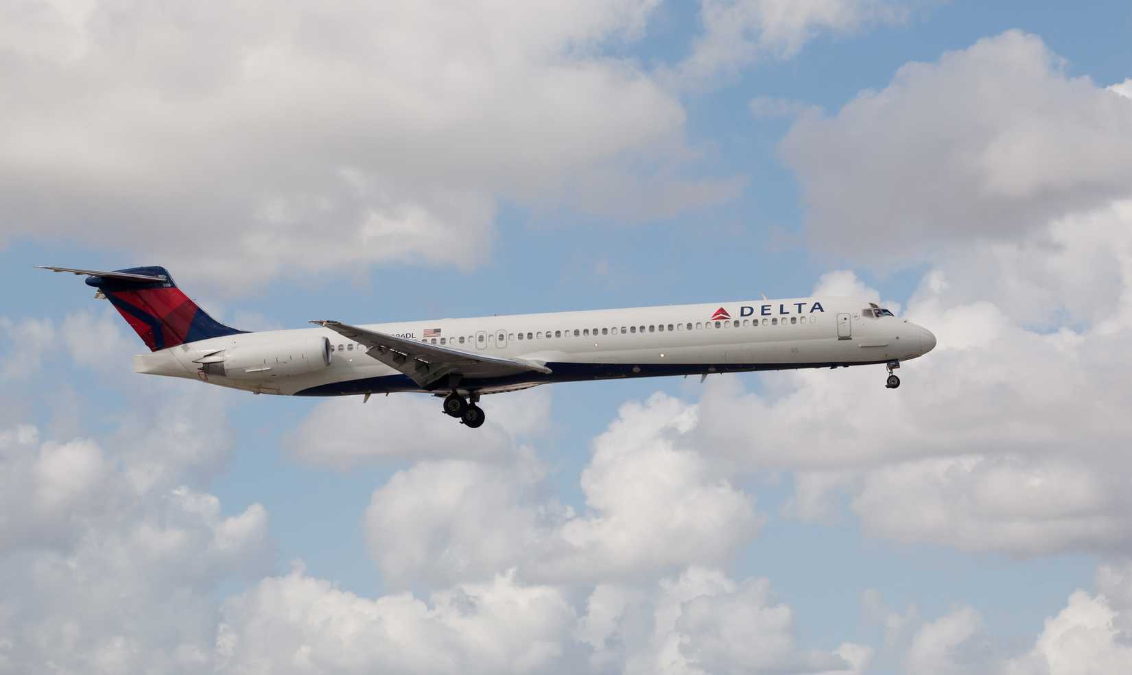 A Delta Air Lines MD-80 aircraft landing at the Miami International Airport.