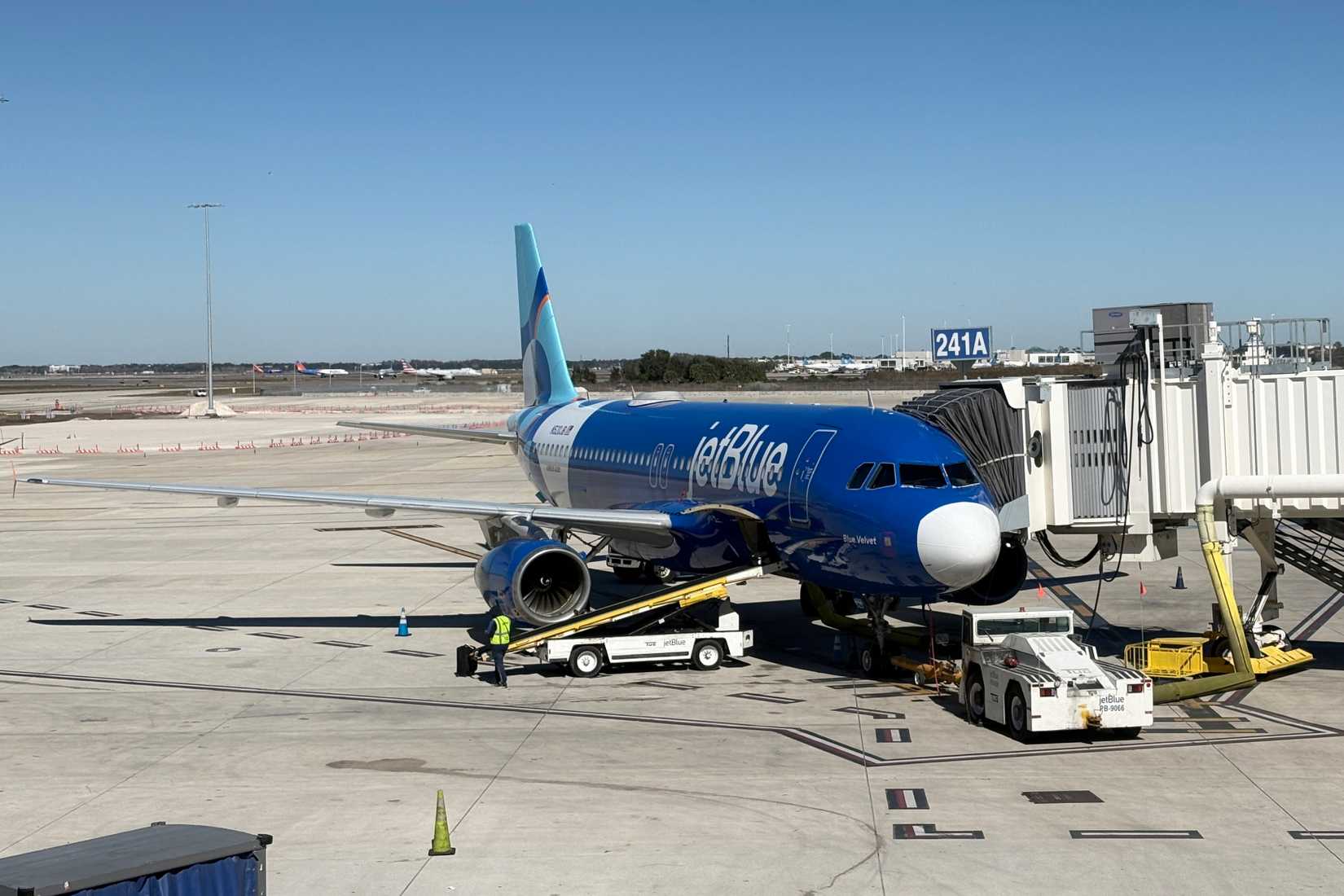 A JetBlue airplane waits to board passengers at Orlando International Airport.