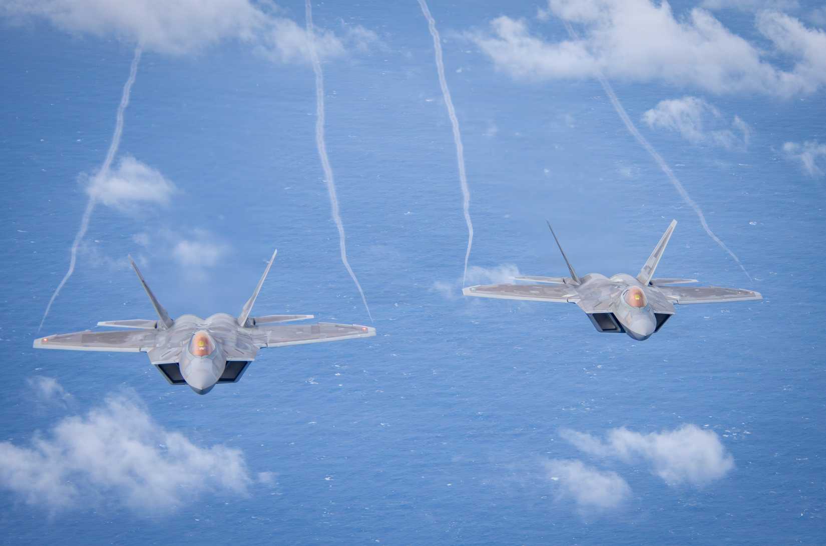 Air Force F-22 Raptors assigned to the 154th Wing, Hawaii Air National Guard, fly in formation.