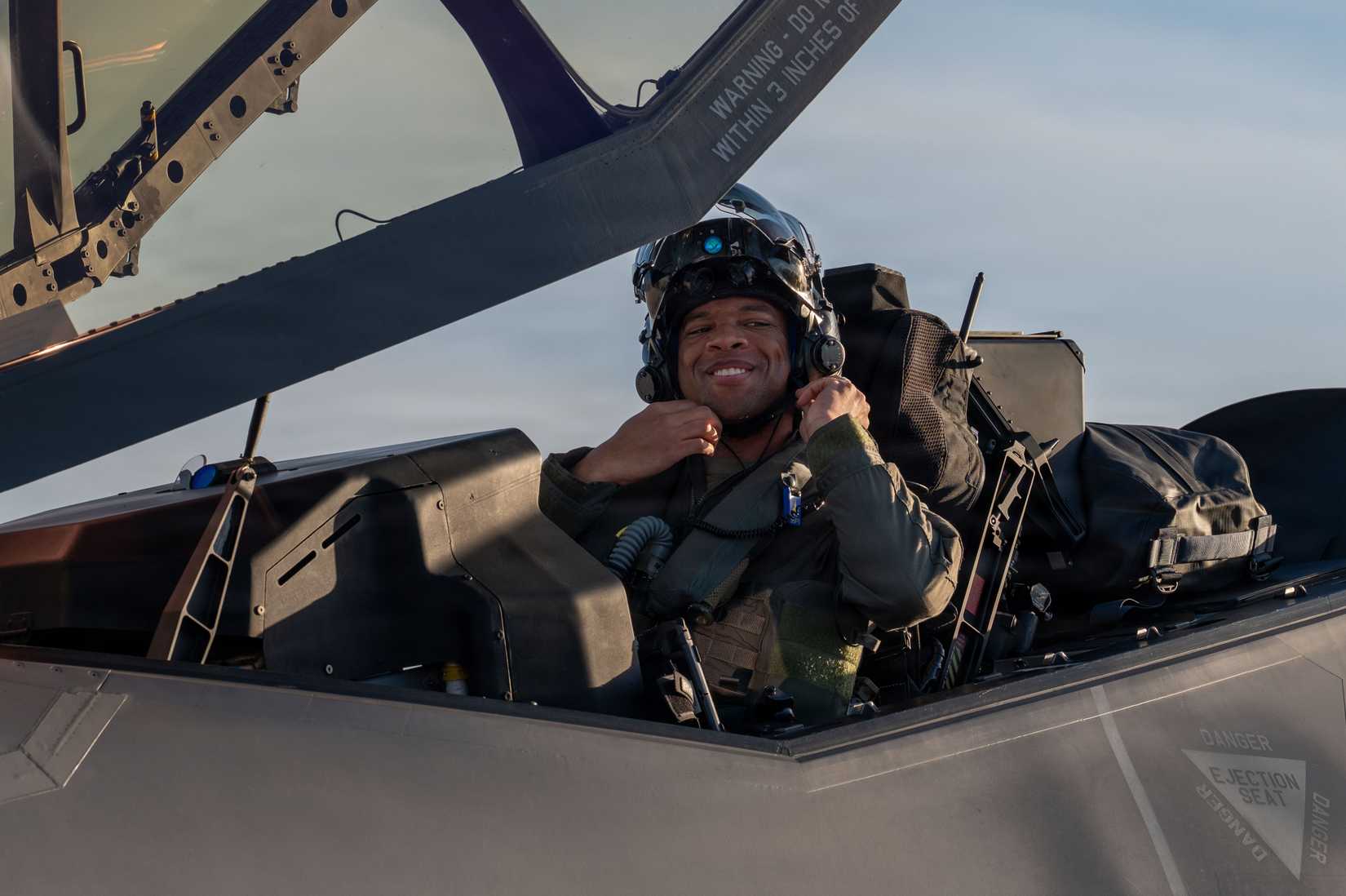 Air Force pilot assigned to the 95th Fighter Squadron opens the canopy of an F-35A Lightning II.