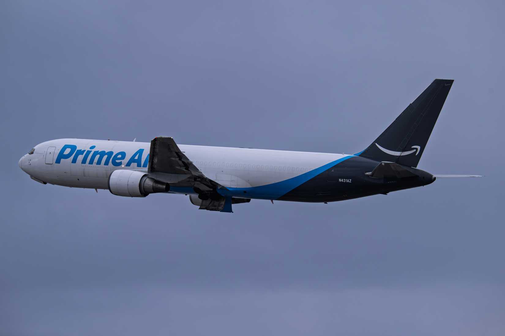 Amazon Prime Air Boeing 767-300 rainy day departure from 7L at Phoenix Sky Harbor Intl. Airport