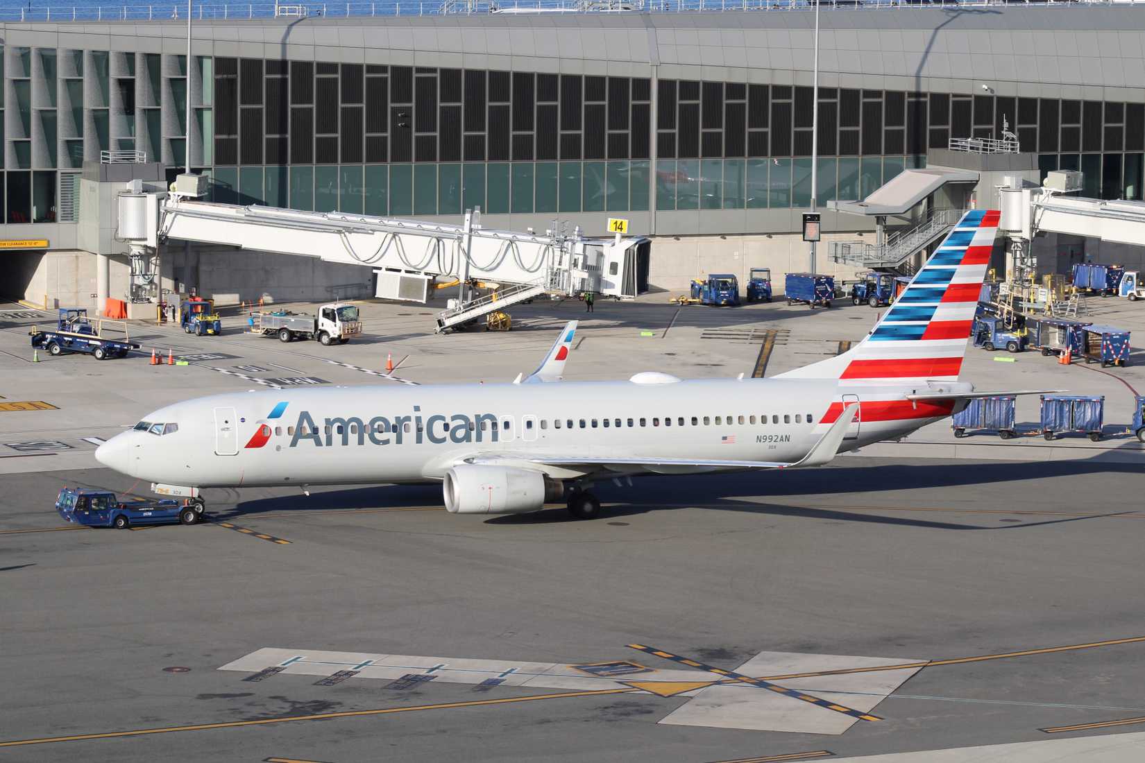 American Airlines Boeing 737 MAX 8 being towed by ground equipment.
