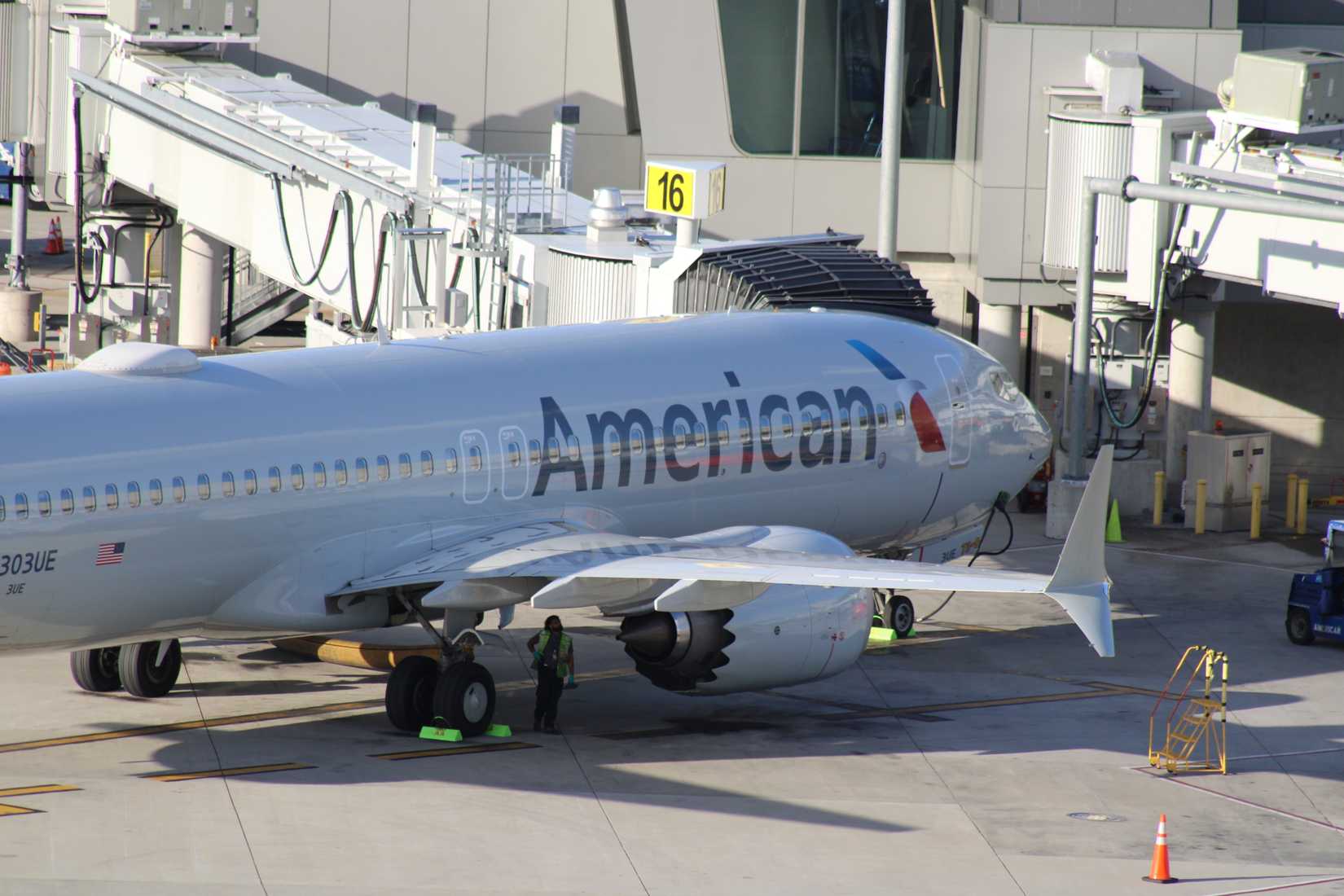 American Airlines Boeing 737 MAX 8 parked at the jet bridge.