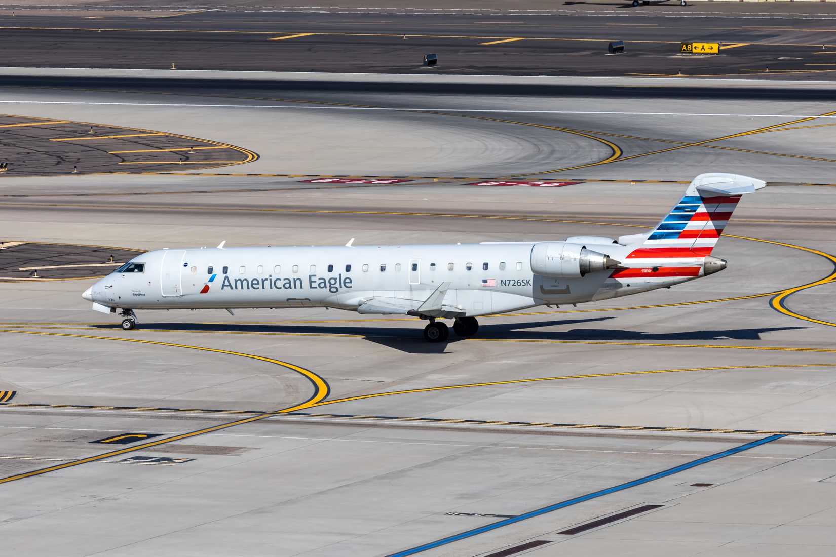 American Eagle operated by SkyWest Airlines Bombardier CRJ-700 airplane at Phoenix airport in the United States.