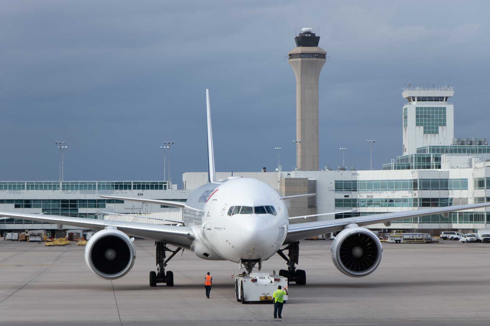 An Air France Boeing 777 prepares to taxi to the runway after pushback at Denver International Airport.