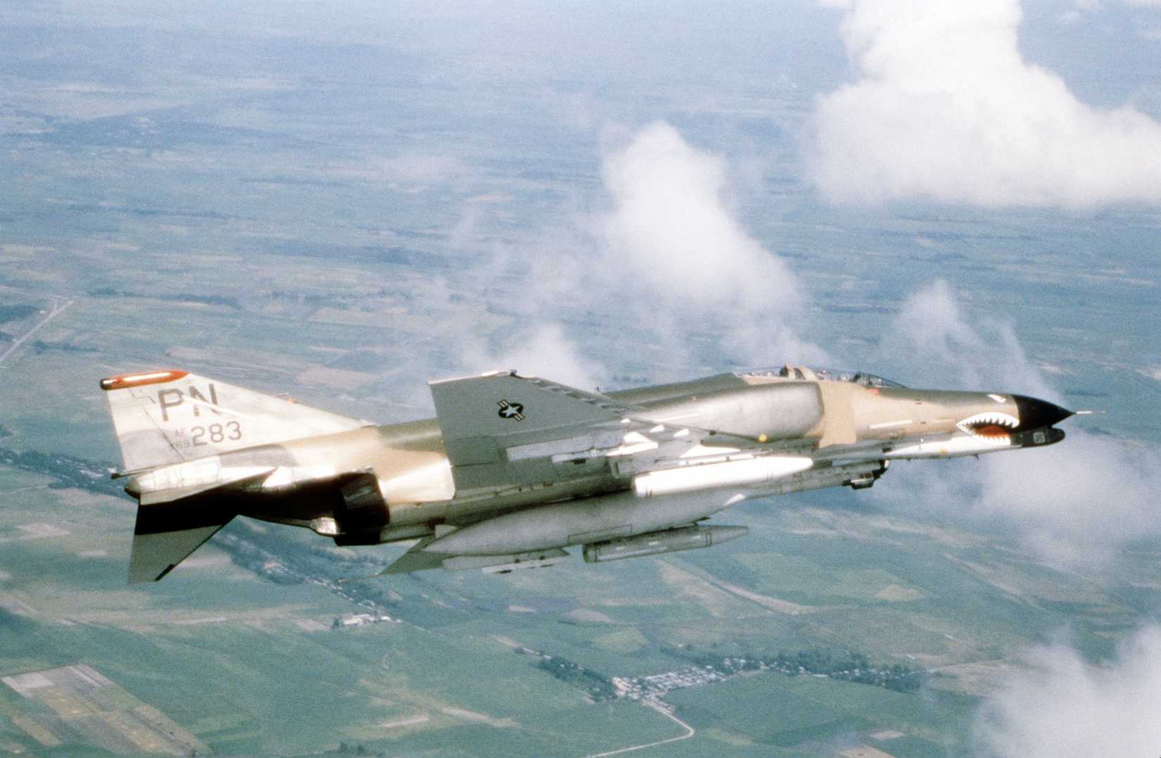 AN air-to-air right side view of an F-4 Phantom II aircraft.