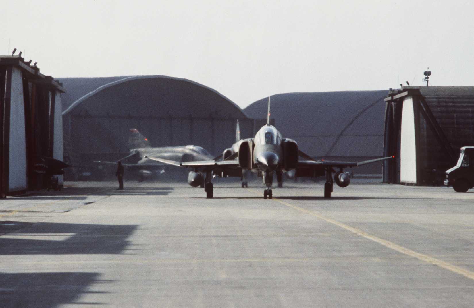 An F-4 Phantom II aircraft is prepared for takeoff from the 36th Tactical Fighter Squadron taxis.