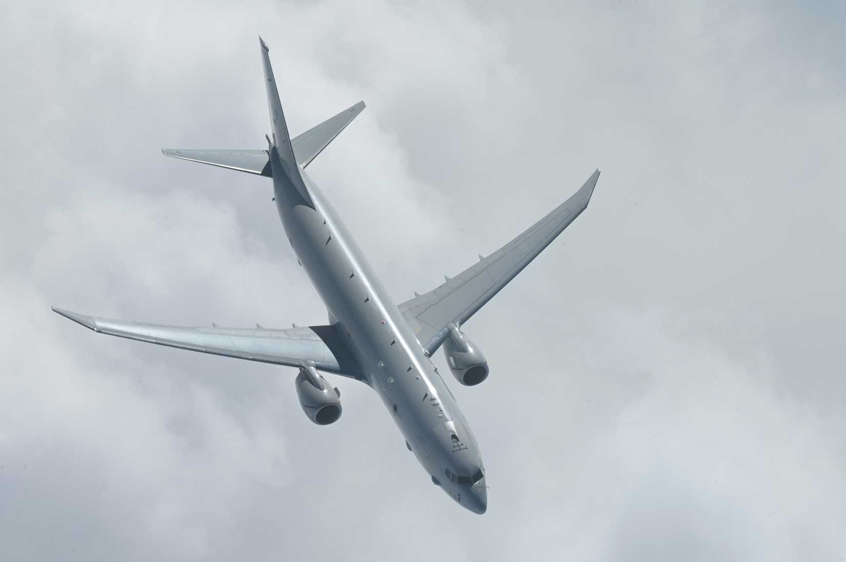 An RAF P-8A Poseidon from the 42 (Torpedo Bomber) Squadron, RAF Lossiemouth, United Kingdom, flies below a KC-135 Stratotanker.