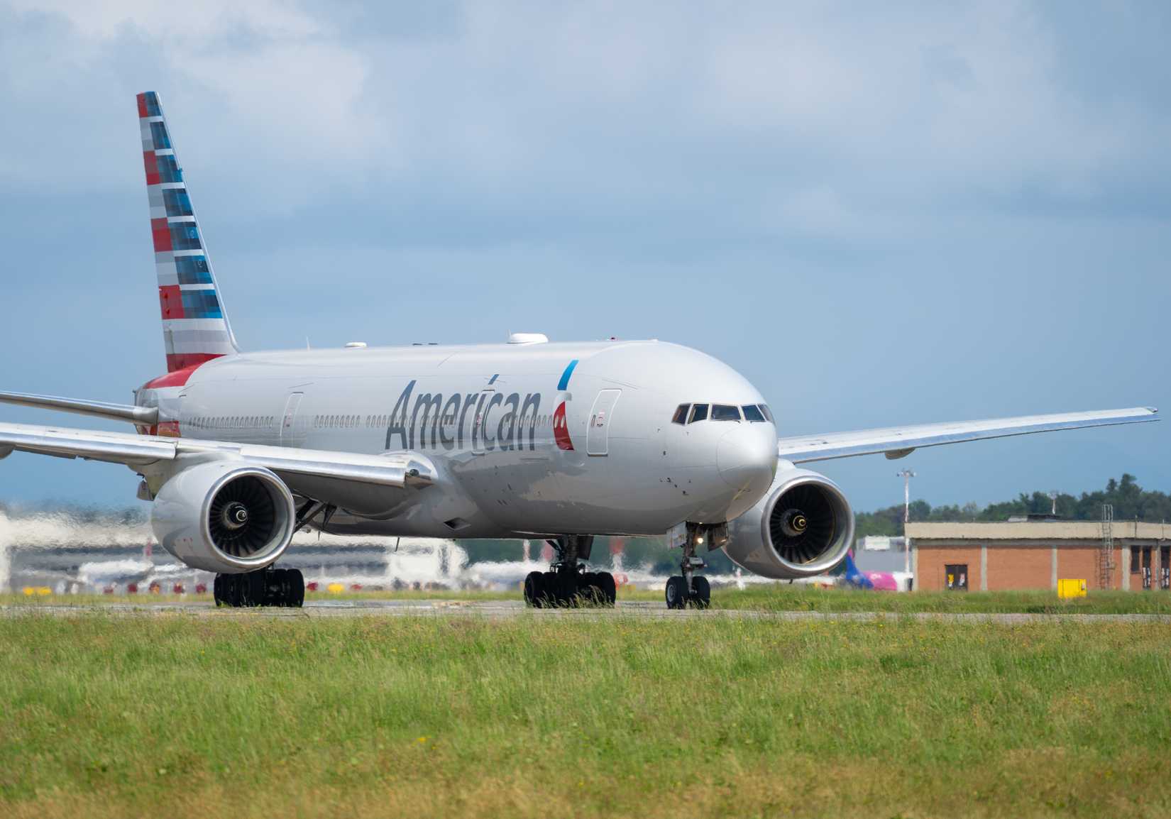 Boeing 777 American Airlines aircraft is taxiing at MXP Milano Malpensa international airport.