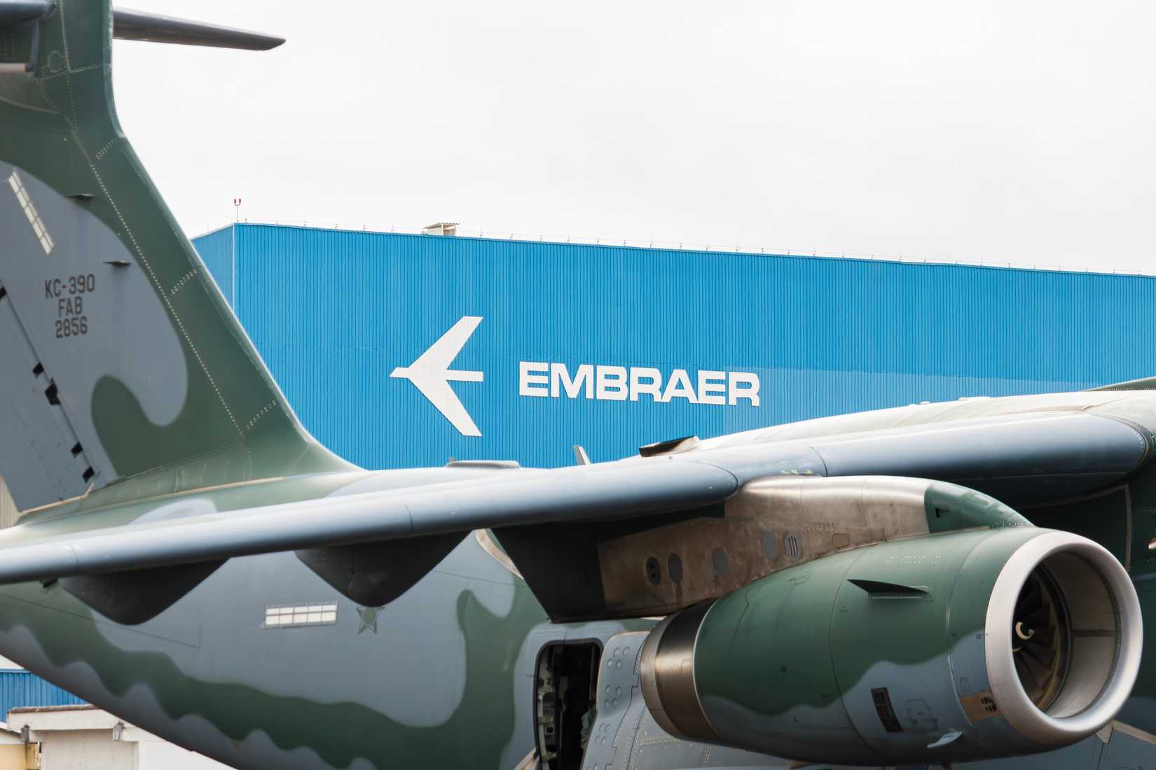 Brazilian Air Force Embraer KC-390 with Embraer headquarters in the background at São José dos Campos Airport, Brazil.
