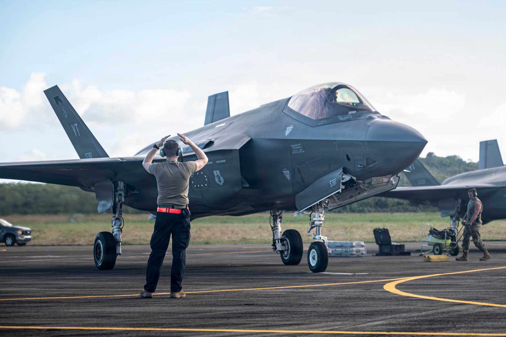 ir Force crew chief marshals an F-35A Lightning II after its first arrival in Ceiba, Puerto Rico, Dec. 20, 2025.