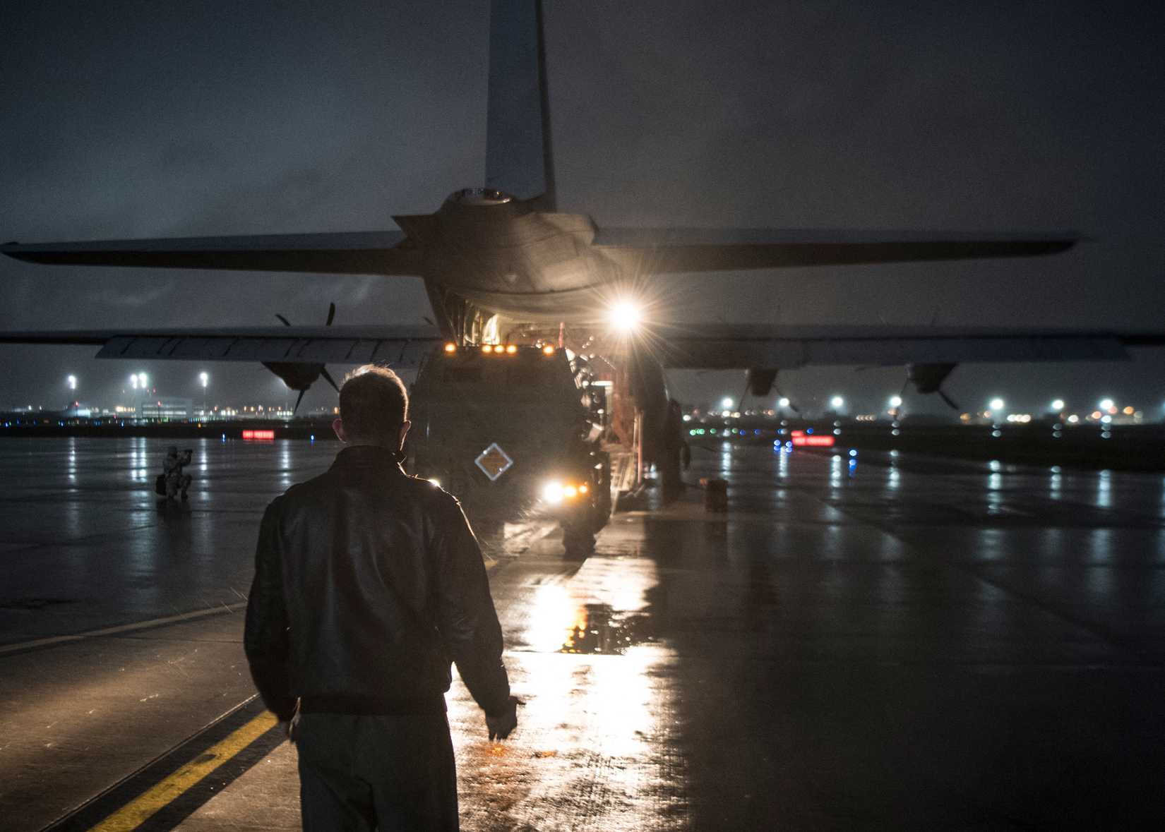 ir Force Tech. Sgt. Tim Gaston, 37th Airlift Squadron loadmaster, guides a High Mobility Artillery Rocket System onto a C-130J Super Hercules aircraft at Ramstein Air Base.