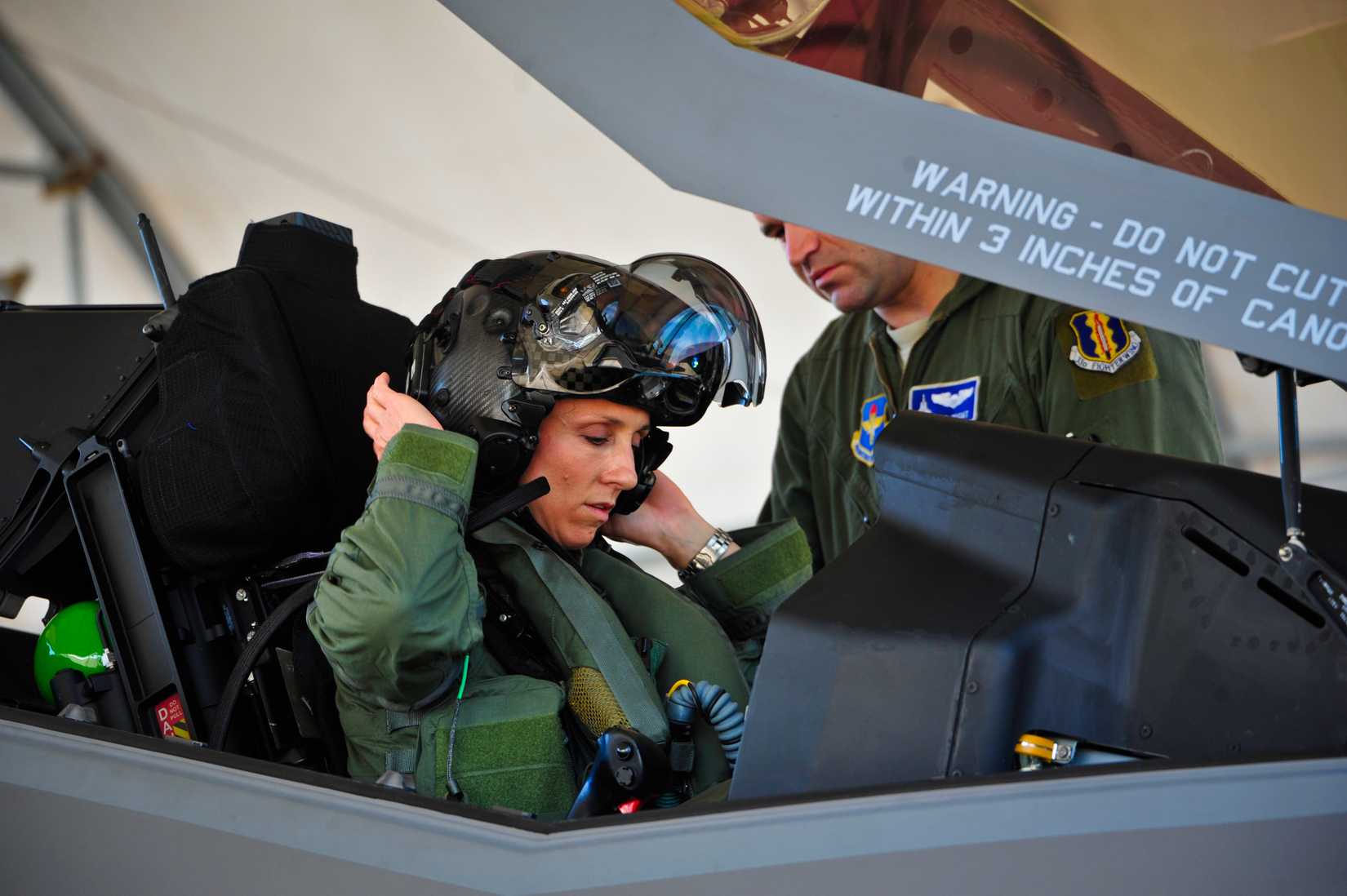 Lt. Col. Christine Mau, 33rd Operations Group deputy commander, puts on her helmet before taking her first flight in the F-35A.