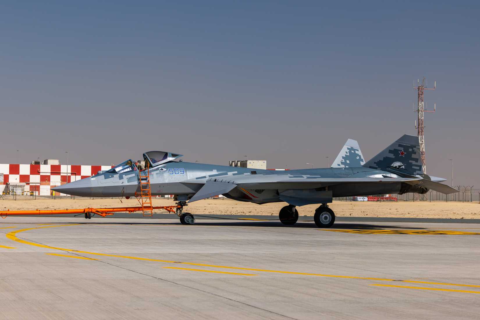 Russian Su-57 fifth-generation stealth fighter aircraft displayed on the tarmac during Dubai Airshow 2025.
