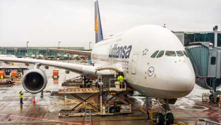 A close-up, high-angle shot of a Lufthansa Airbus A380-800, registration D-AIMB (named