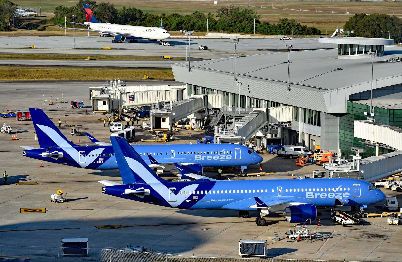 Breeze Airways Airbus A220-300 aircraft preparing for their flights at Tampa International Airport