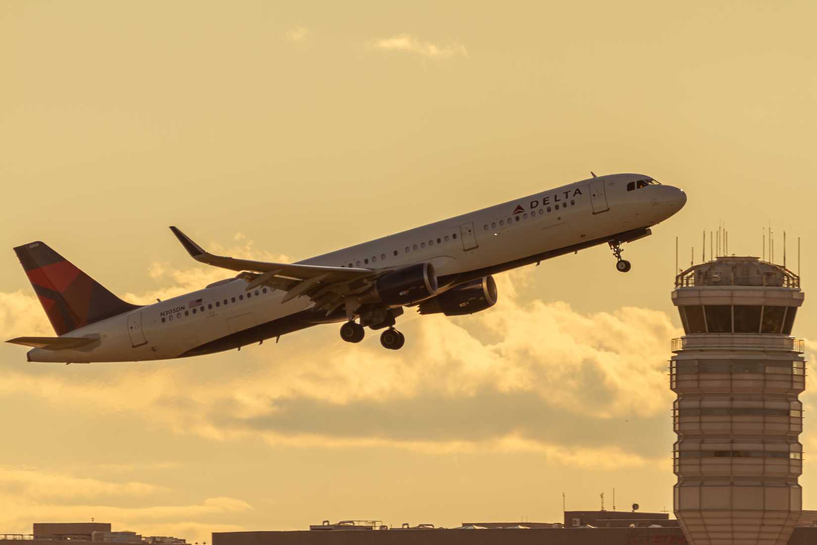 Sunset view of an Airbus A321 model airplane operated by Delta Air Lines.
