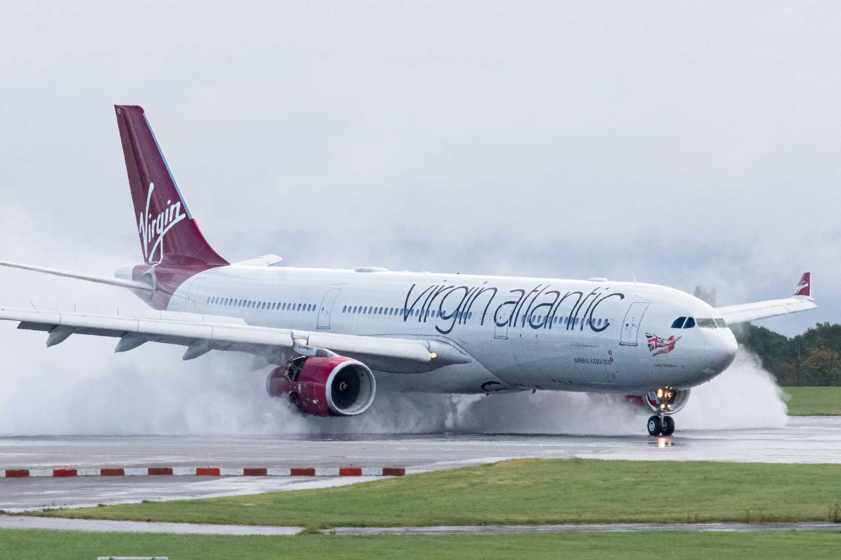 Virgin Atlantic Airbus A330-300 G-VUFO arriving at a wet Manchester Airport.