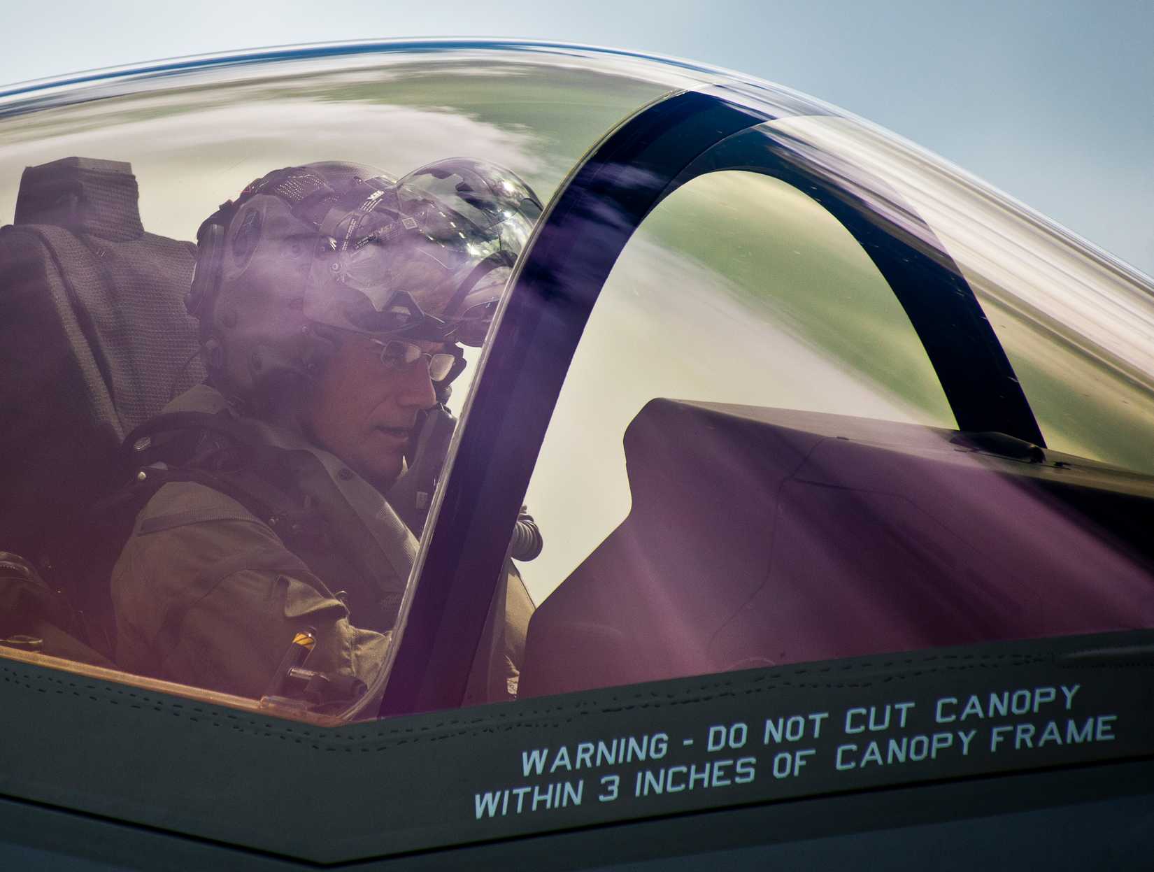 Maj. Gen. Jay Silveria, U.S. Air Force Warfare Center commander, takes a break in an F-35A Lightning II while the aircraft is refueling during his final qualifying flight Sept. 26, 2014, at Eglin Air Force Base