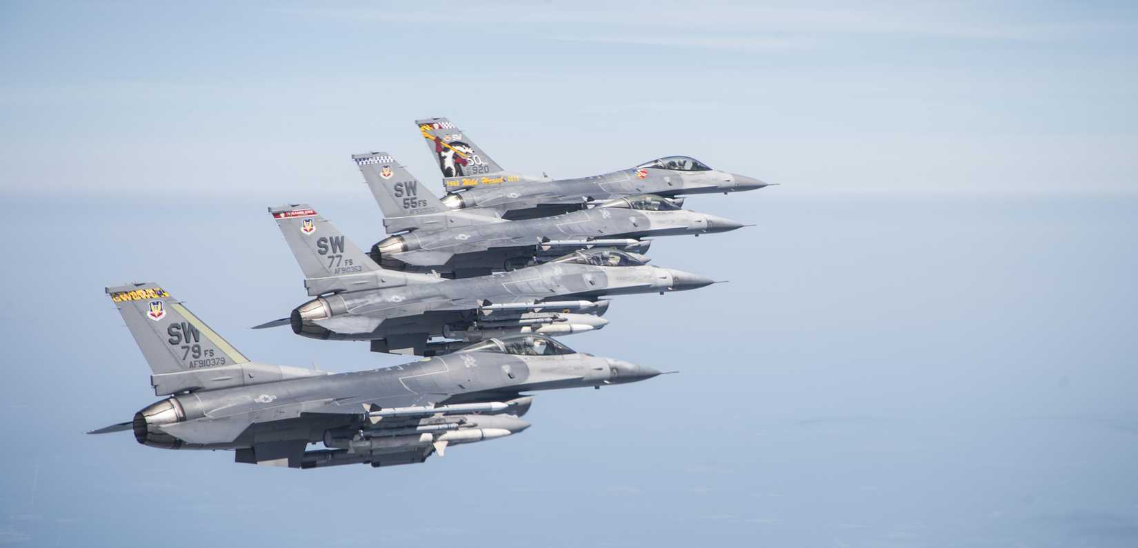 A four-ship formation of 20th Fighter Wing (FW) F-16CM Fighting Falcons fly off the coast of South Carolina, July 21, 2017, commemorating the 100th anniversary of the 55th Fighter Squadron (FS.) The formation consisted of flagship aircraft from the 20th FW, the 55th, 77th and 79th FSs. 