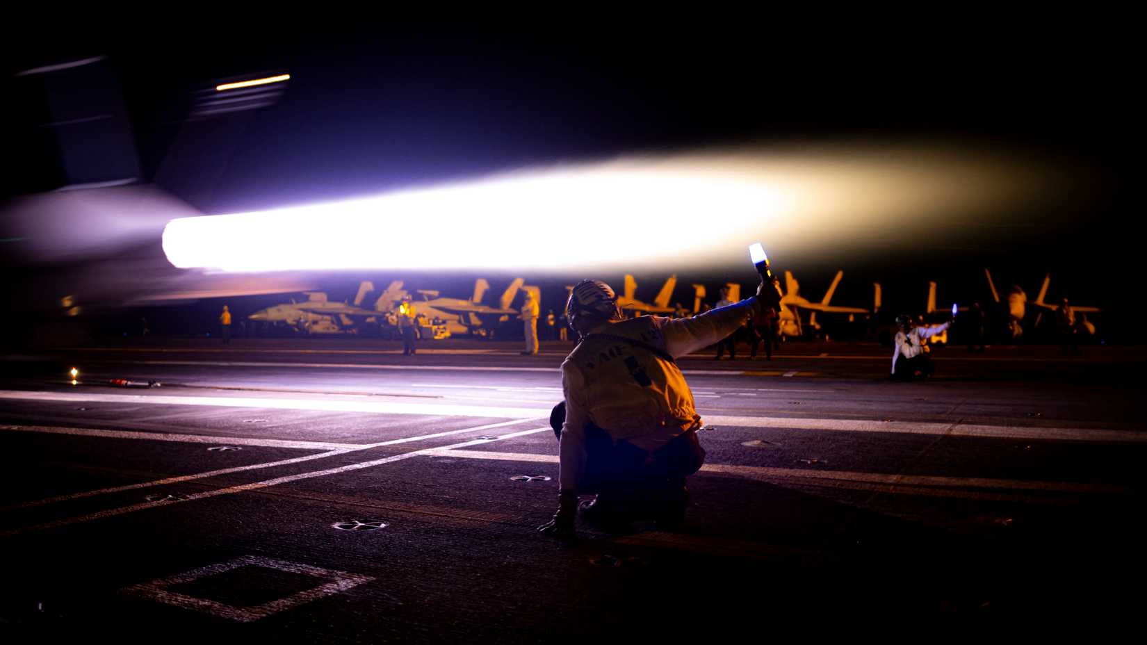 A Carrier Air Wing 8 EA-18G Growler, attached to Electronic Attack Squadron 142, launches at night.