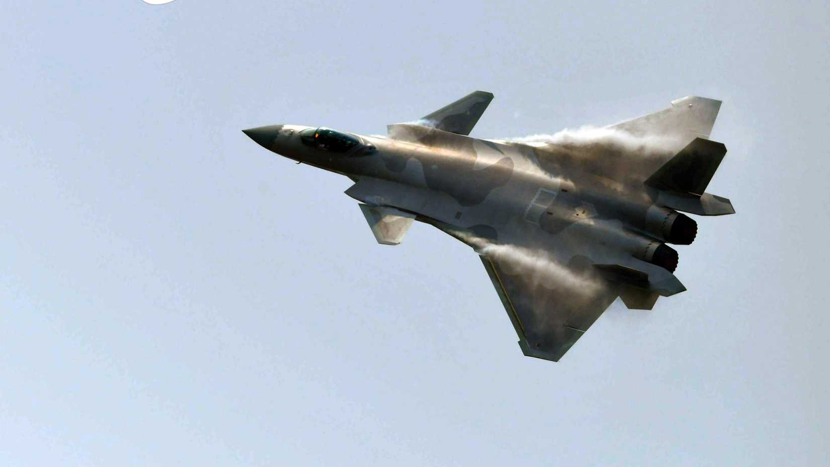 A J-20 stealth fighter jet performs aerobatics during the 13th China International Aviation and Aerospace Exhibition, or Airshow China 2021, in Zhuhai, South China's Guangdong province on Sept 29, 2021.