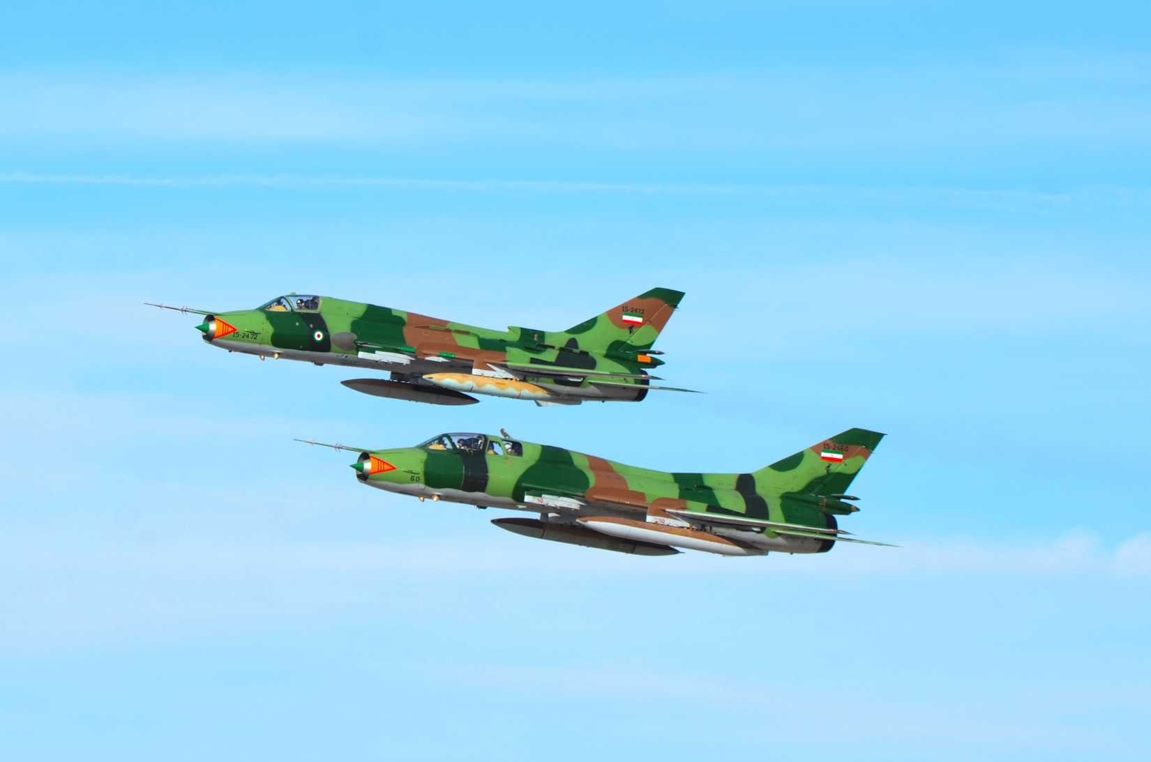 A pair of Iranian Sukhoi Su-22 Fitter belong to the IRGC AF flying past during the Kish air show.