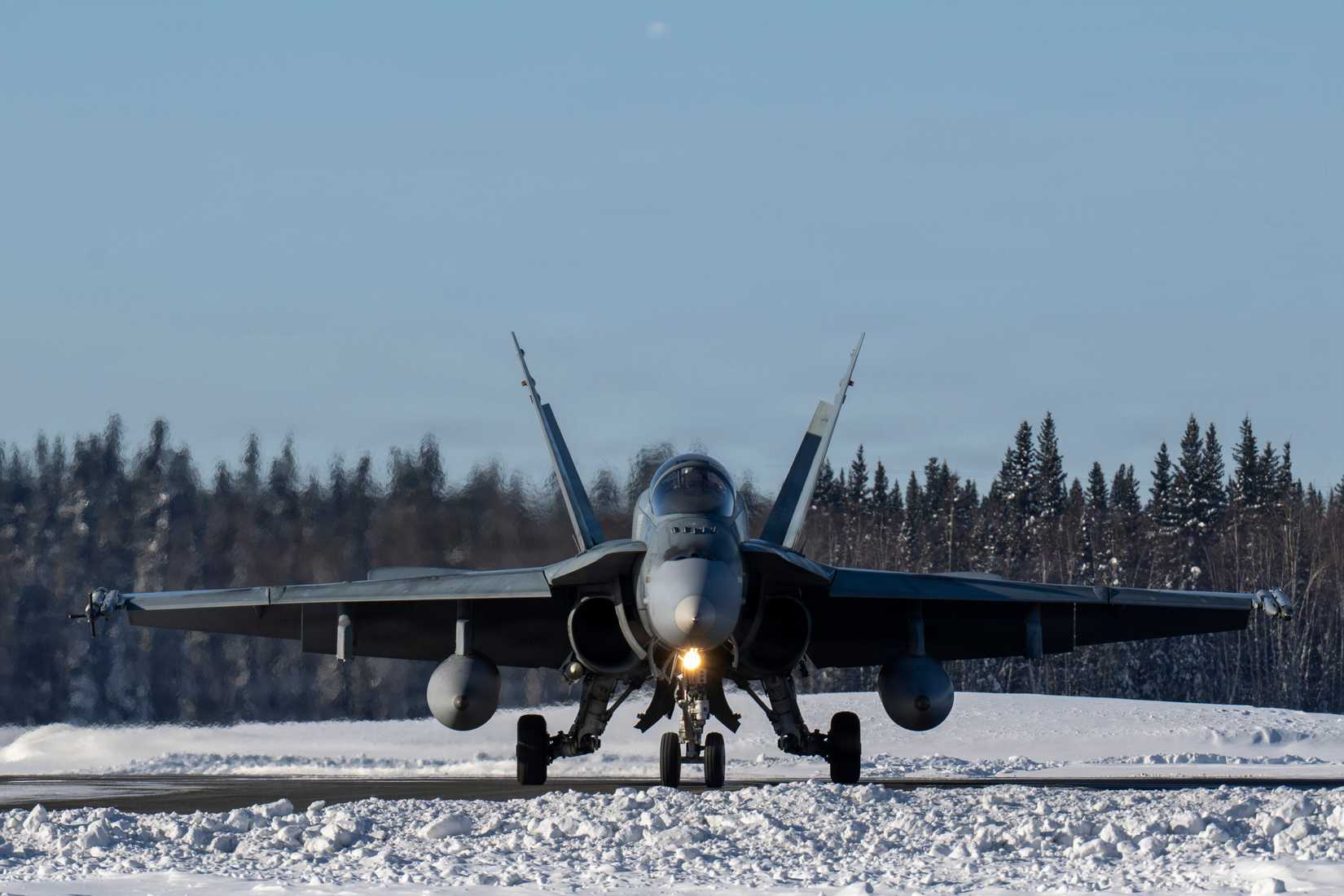 A Royal Canadian Air Force CF-18 Hornet assigned to the 425th Tactical Fighter Squadron returns to the flight line during ARCTIC EDGE 2026.