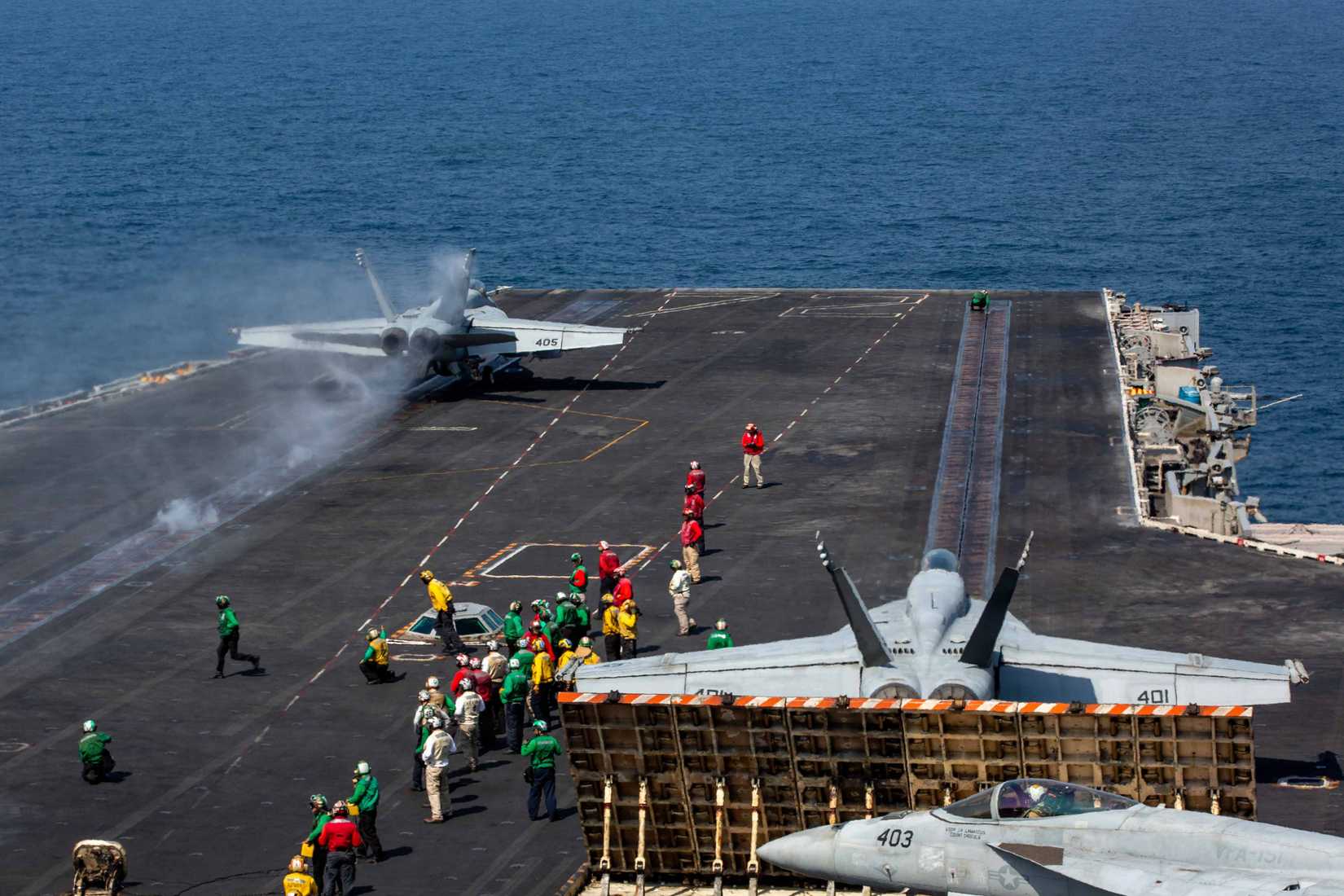 A Super Hornet prepares to launch from the flight deck of Nimitz-class aircraft carrier USS Abraham Lincoln (CVN 72) in support of Epic Fury.