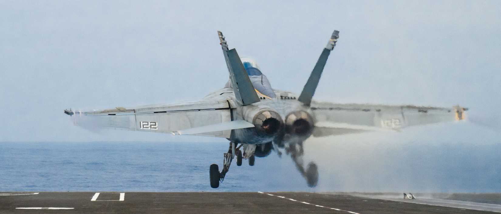 A US Navy FA-18F Super Hornet, assigned to the “Flying Eagles” of Strike Fighter Squadron (VFA) 122, launches.