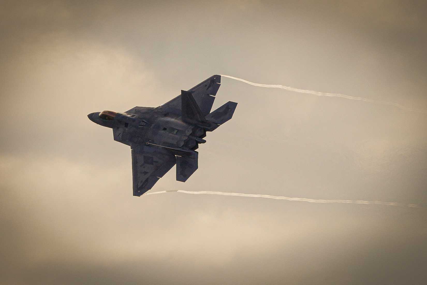 Air Force F-22 Raptor assigned to the 90th Fighter Squadron soars over Joint Base Elmendorf- Richardson during ARCTIC EDGE 2025.