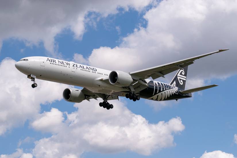 Air New Zealand Boeing 777 flying across cloudy skies