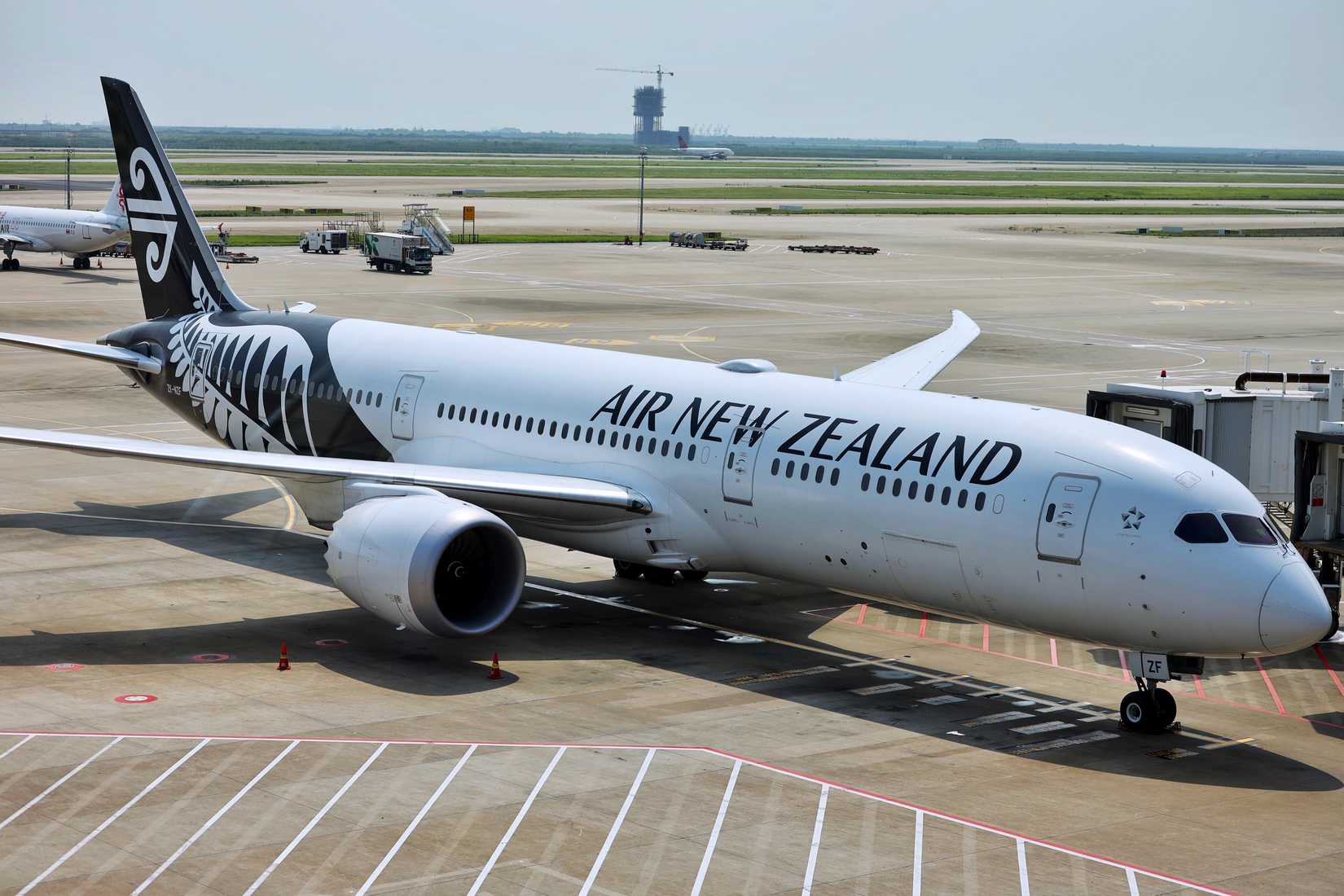 Air New Zealand Boeing 787 parked at the terminal gate