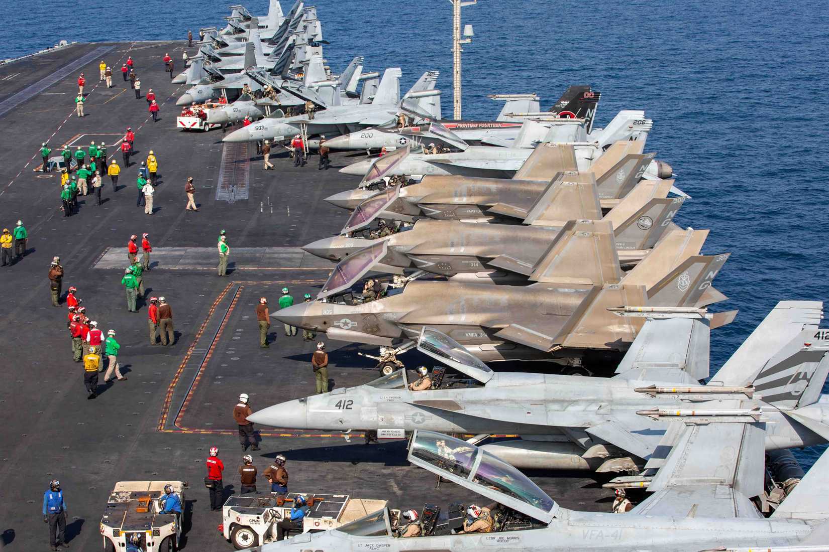 Aircraft attached to Carrier Air Wing (CVW) 9 sit on the flight deck of Nimitz-class aircraft carrier USS Abraham Lincoln (CVN 72) in support of Operation Epic Fury.