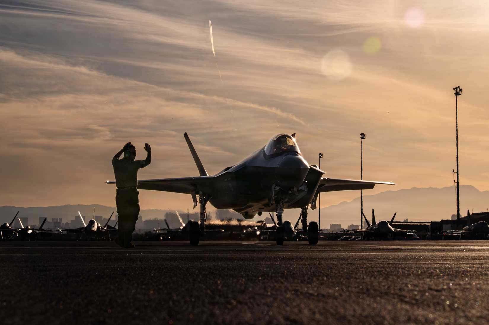 Airmen assigned to the 95th Fighter Generation Squadron marshals an F-35A Lightning II aircraft, assigned to the 325th Fighter Wing.