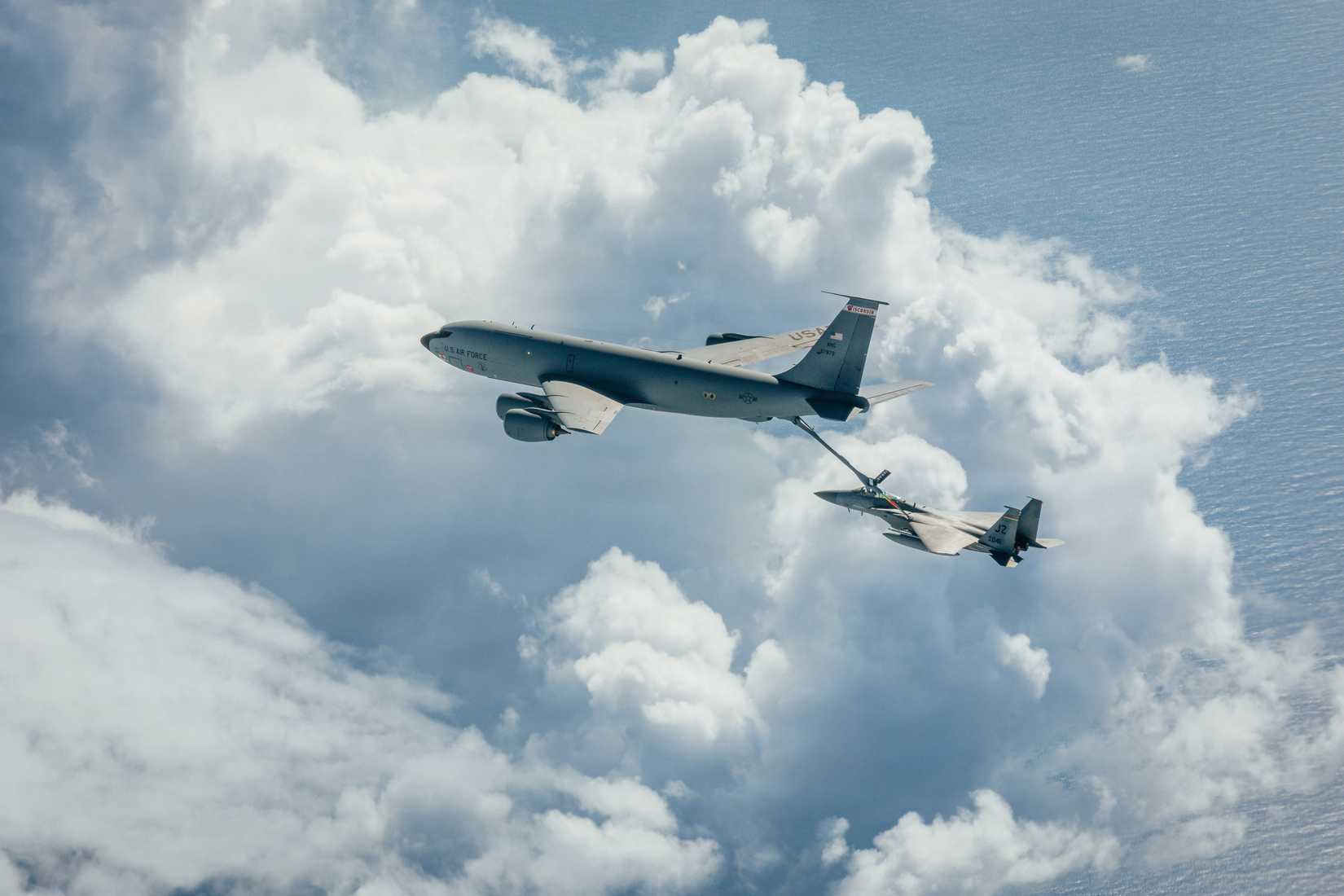 An F-15 Eagle from the 159th Fighter Wing receives mid-flight refueling from a KC-135 Stratotanker.