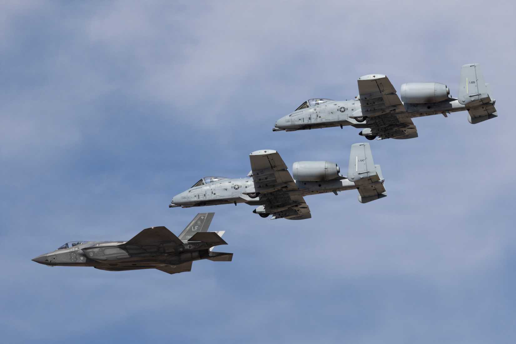 An F-35A assigned to Luke Air Force Base and two A-10s assigned to Davis Monthan Air Force Base fly in formation.